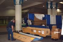 Unpacking and constructing booth - "Men At Work"