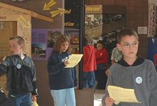 Students studying the displays at the Visitors Center