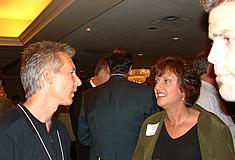 Denny Reinert of BroadbandVideo talks with Maxine Brand. David Heib CTEK